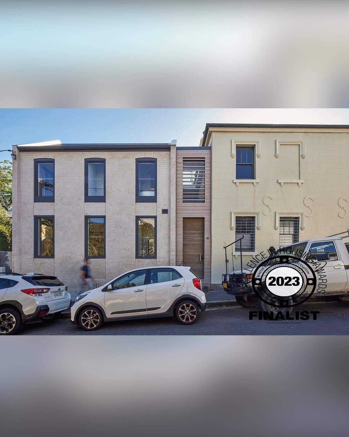 Pair of rendered terrace houses with the Barnes ute parked in front